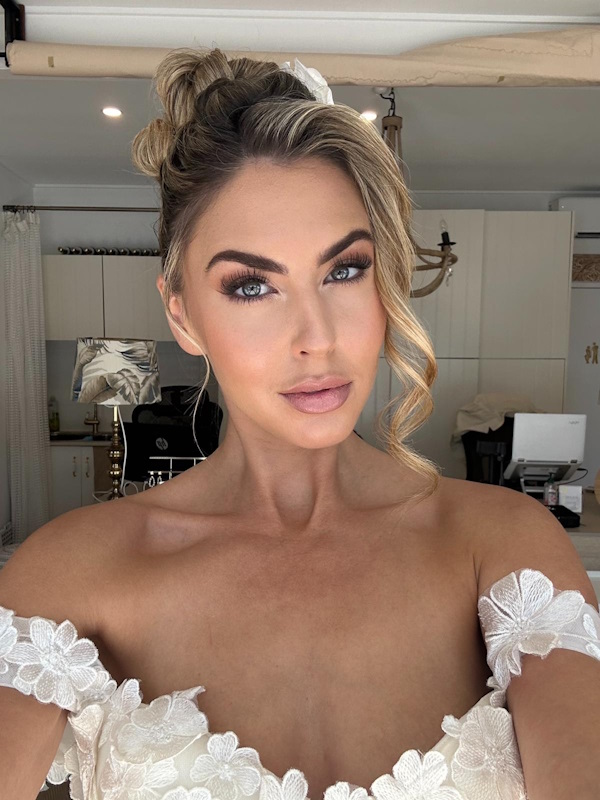 Gold Coast bride with soft glam and high updo in lace gown